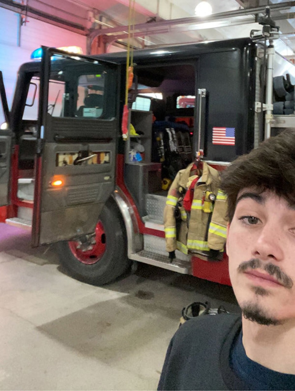 Cardinal High School student takes a selfie with a fire truck during a job shadowing opportunity.