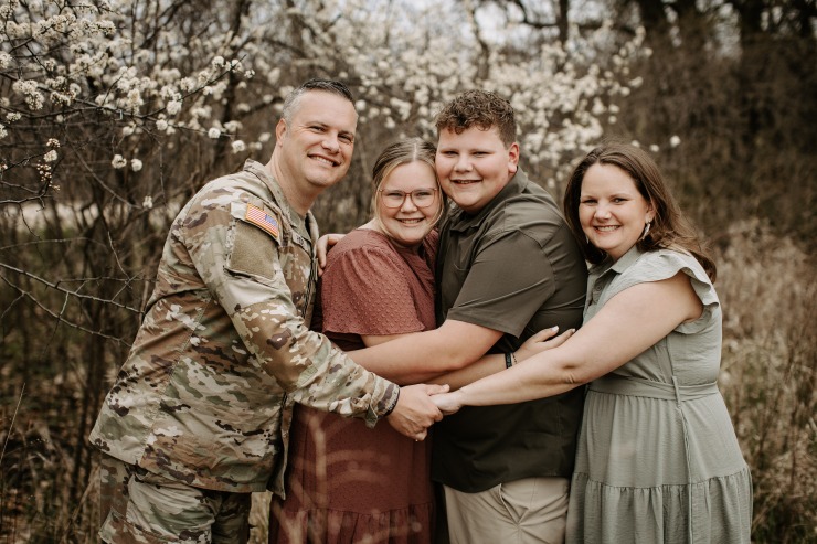 New Cardinal HS Math teacher Bethany Hadley with her husband and two children.