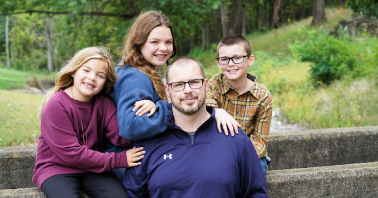 William Pester poses with his three children.